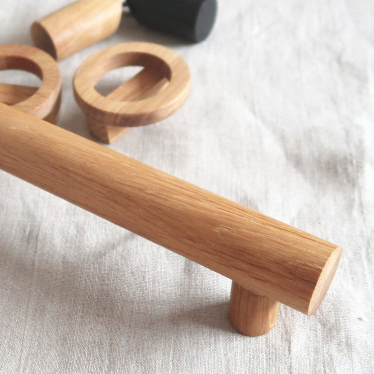 Minimalist oak wood handles on natural linen background – Wood Decor Collection