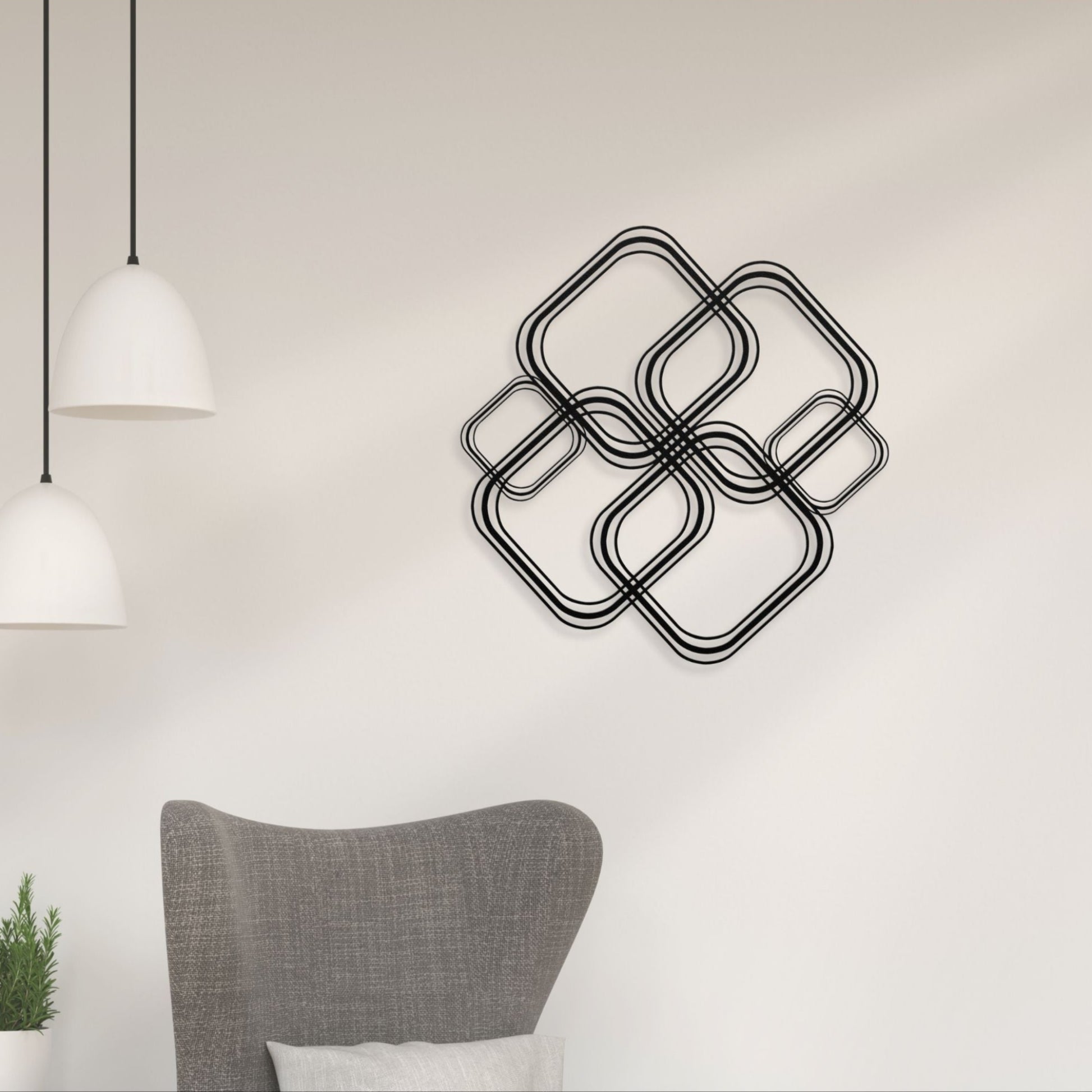 Decorative wall art with interlocking square shapes on a light wall.
