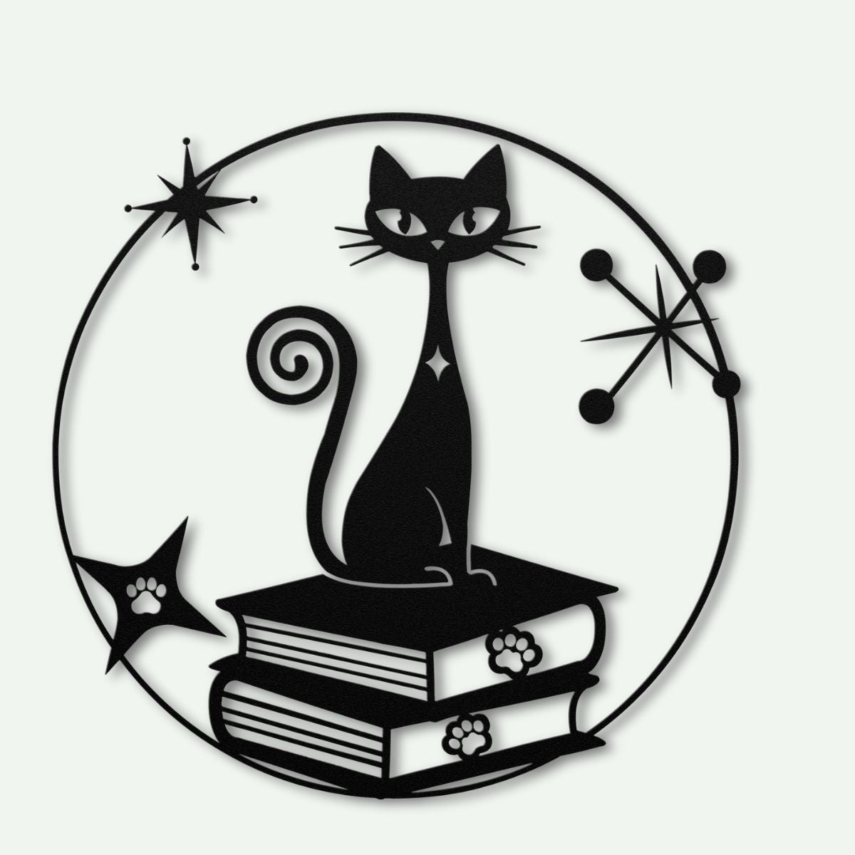 mid century modern metal wall art atomic cat on books against a white background