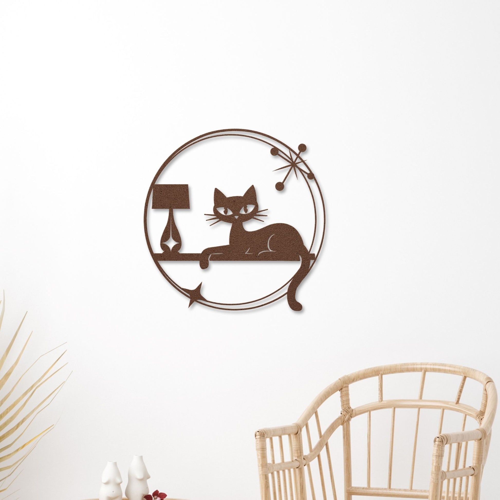 Retro-style decorative metal wall art with a cat silhouette and atomic starburst design