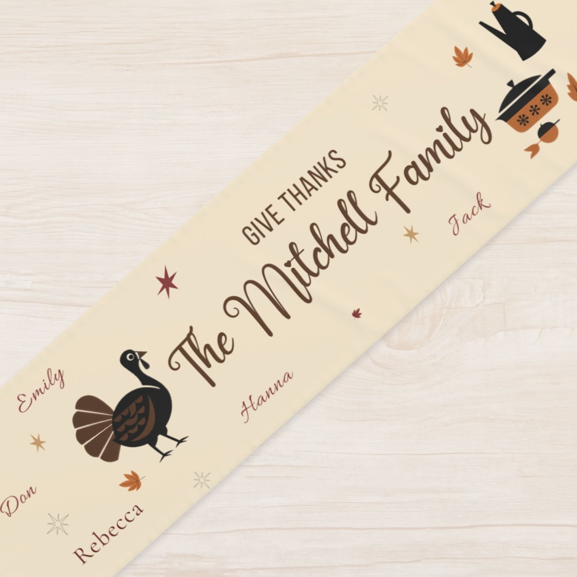 Personalized Thanksgiving runner with family names on a wooden surface
