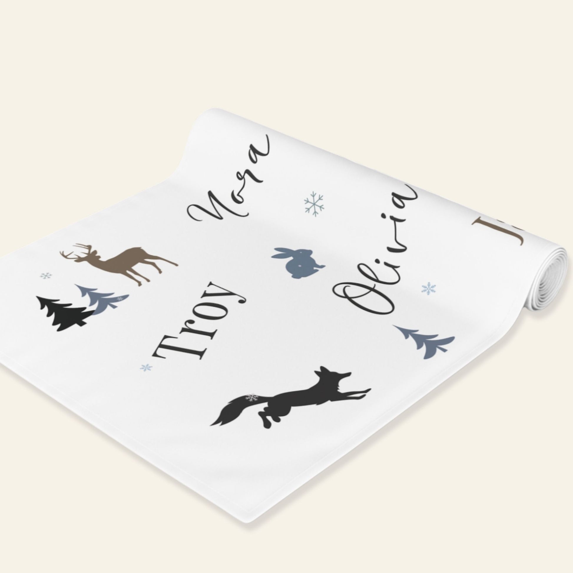 Personalized white runner with animal silhouettes and names on a white background