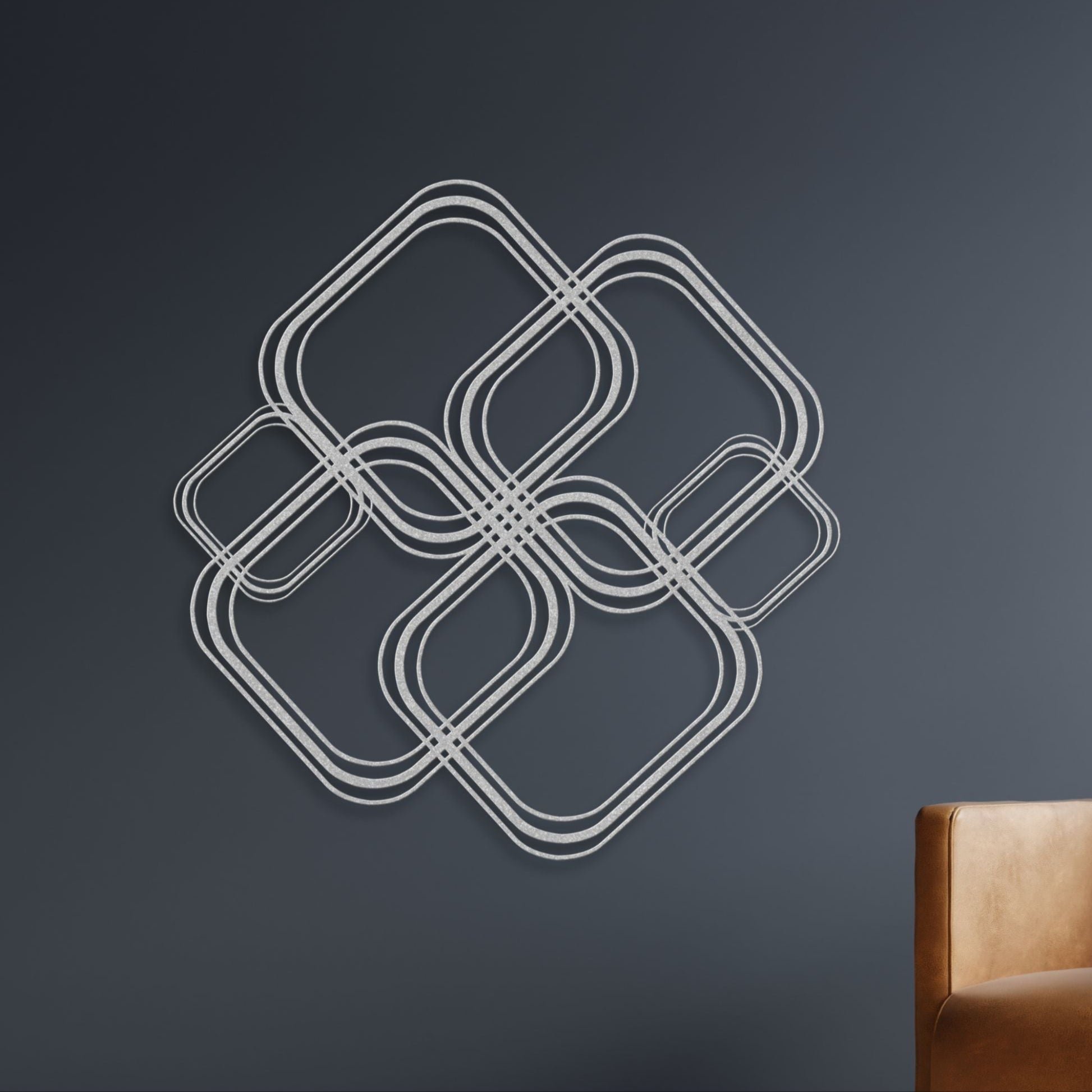 Modern metal wall art, abstract design against a dark background.