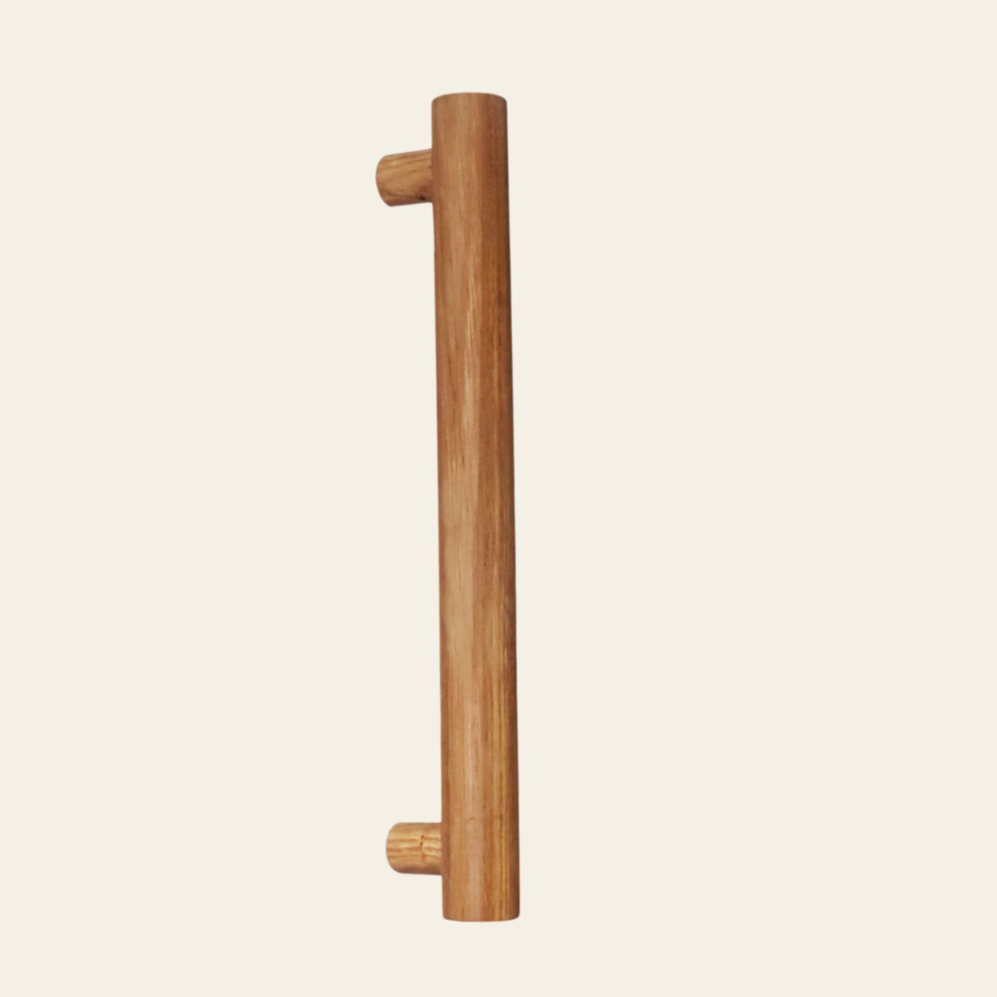 Wooden door handle on a beige background