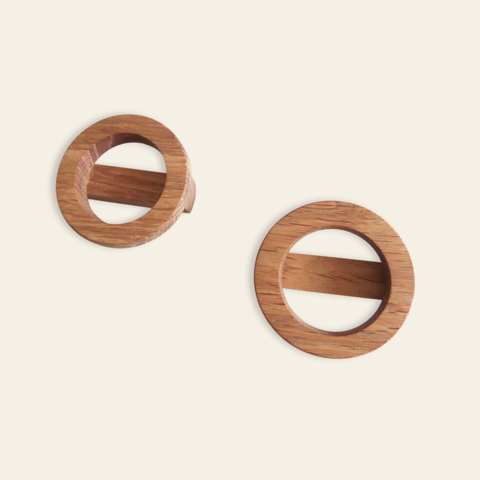 Wooden circular knobs on a beige background
