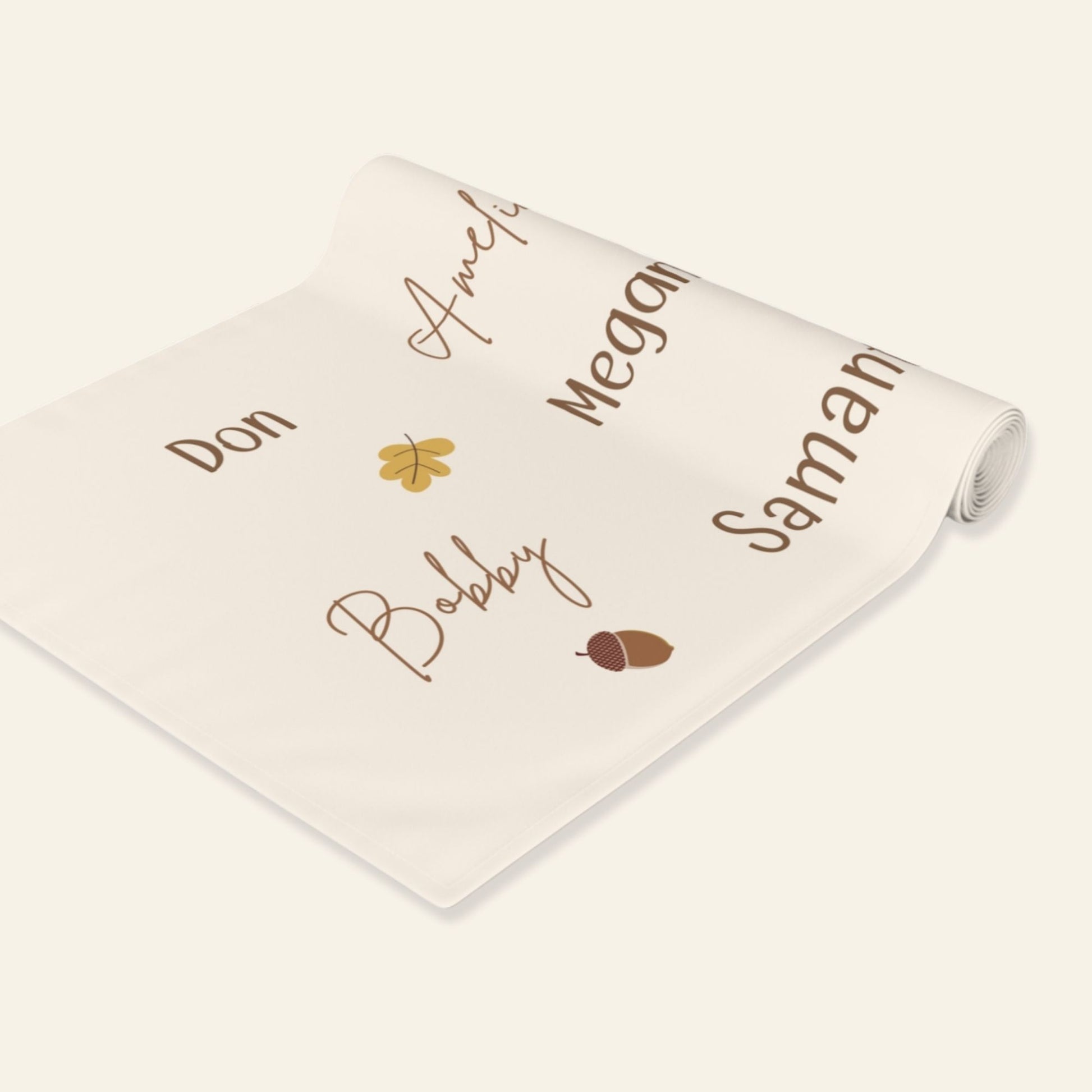 Personalized table runner with names printed on it against a white background