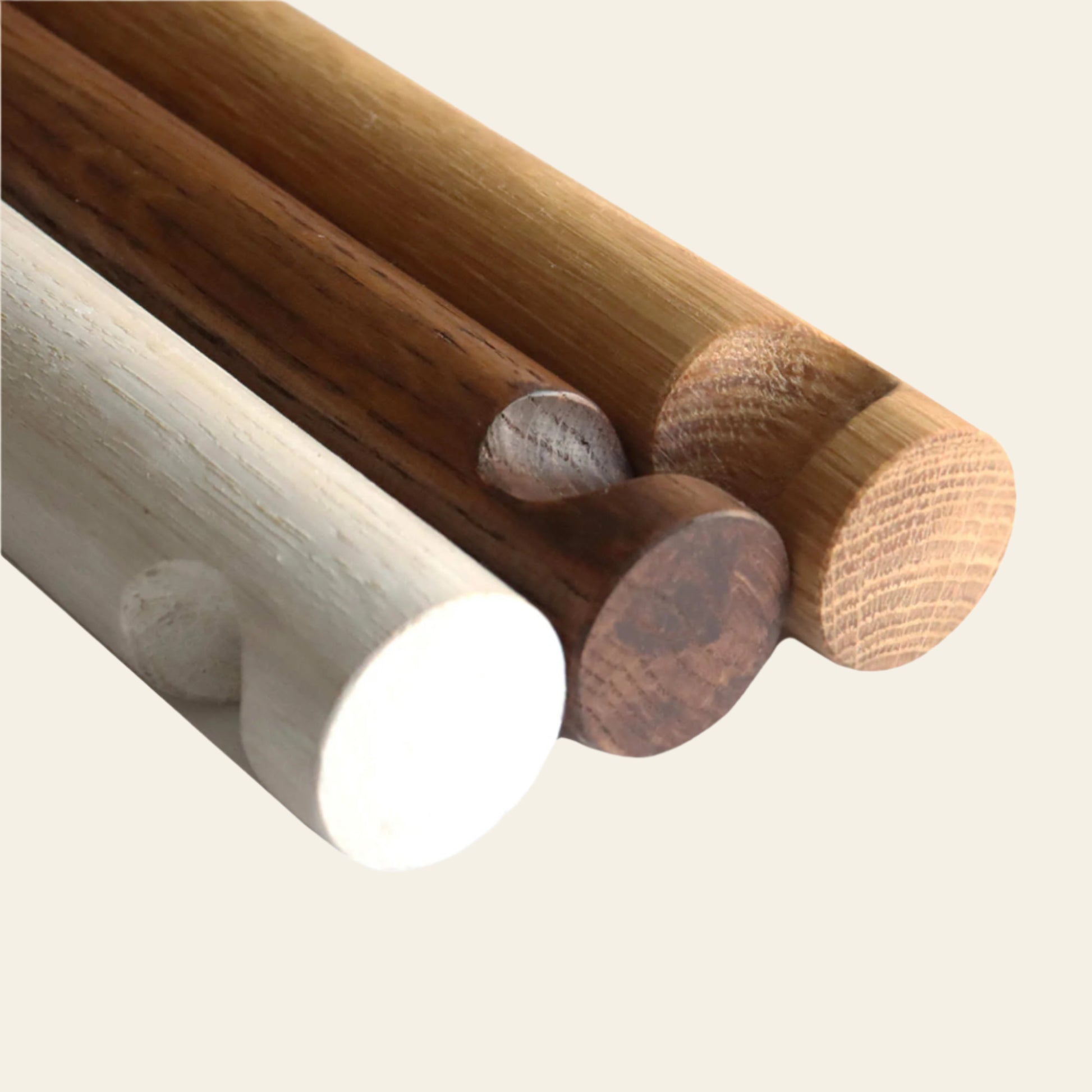 Long wooden wall hooks in natural, dark, and whitewashed finishes for plants and decorative accessories