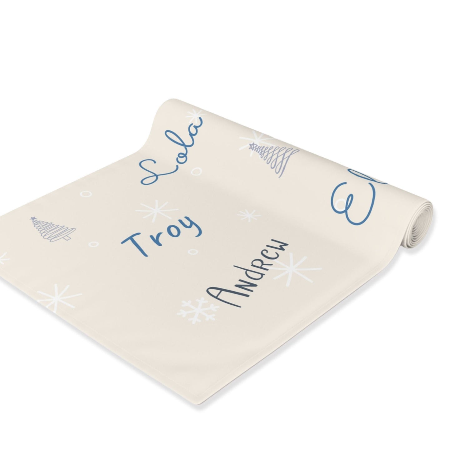 Roll of beige table runner with names printed on a white background