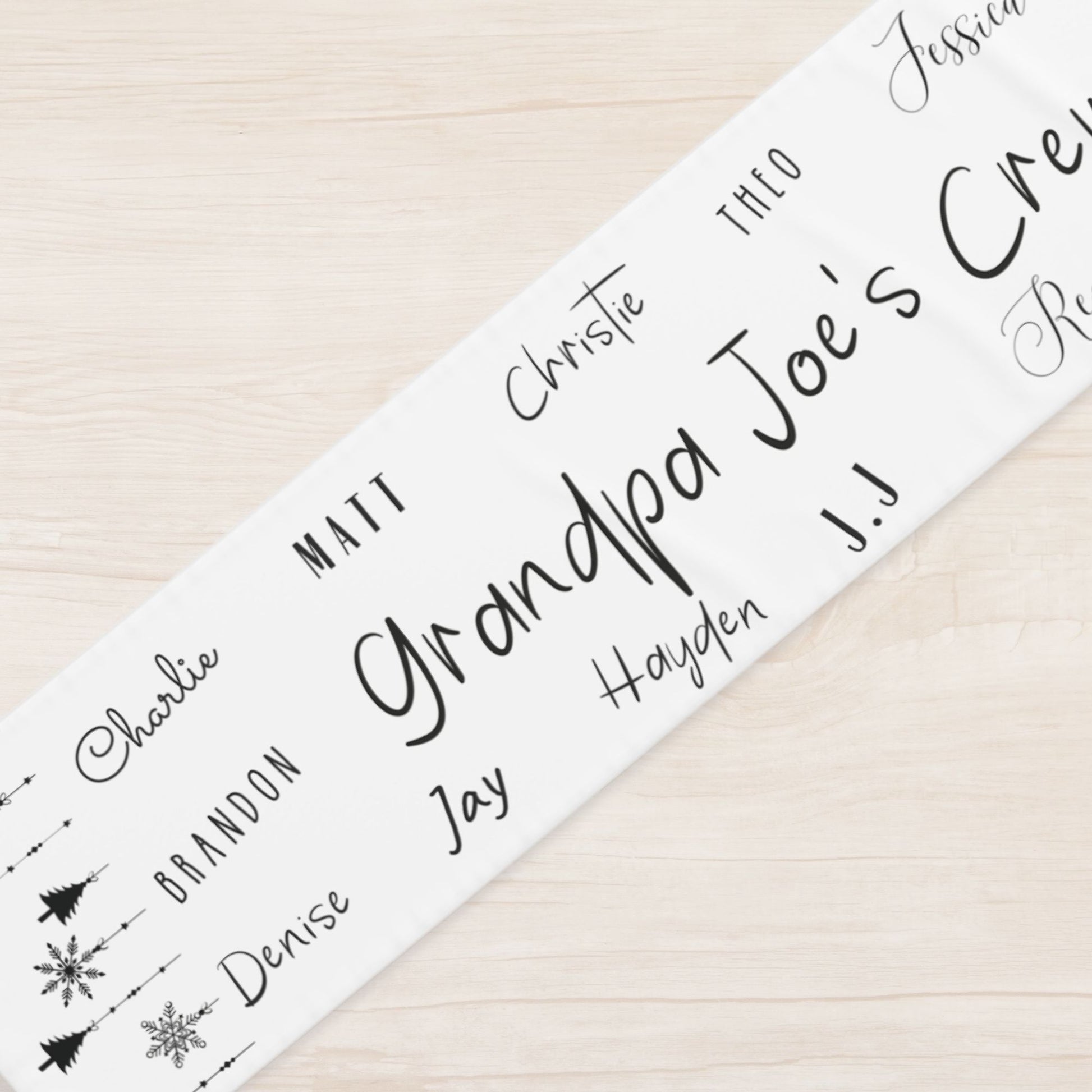 Custom holiday table runner with family name and names of loved ones, modern minimalist style