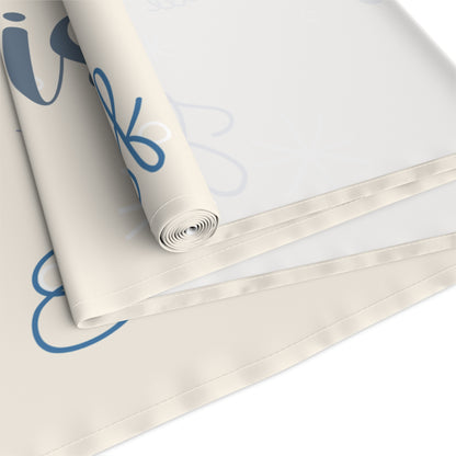 Roll of table runner with blue text on a white backgroun