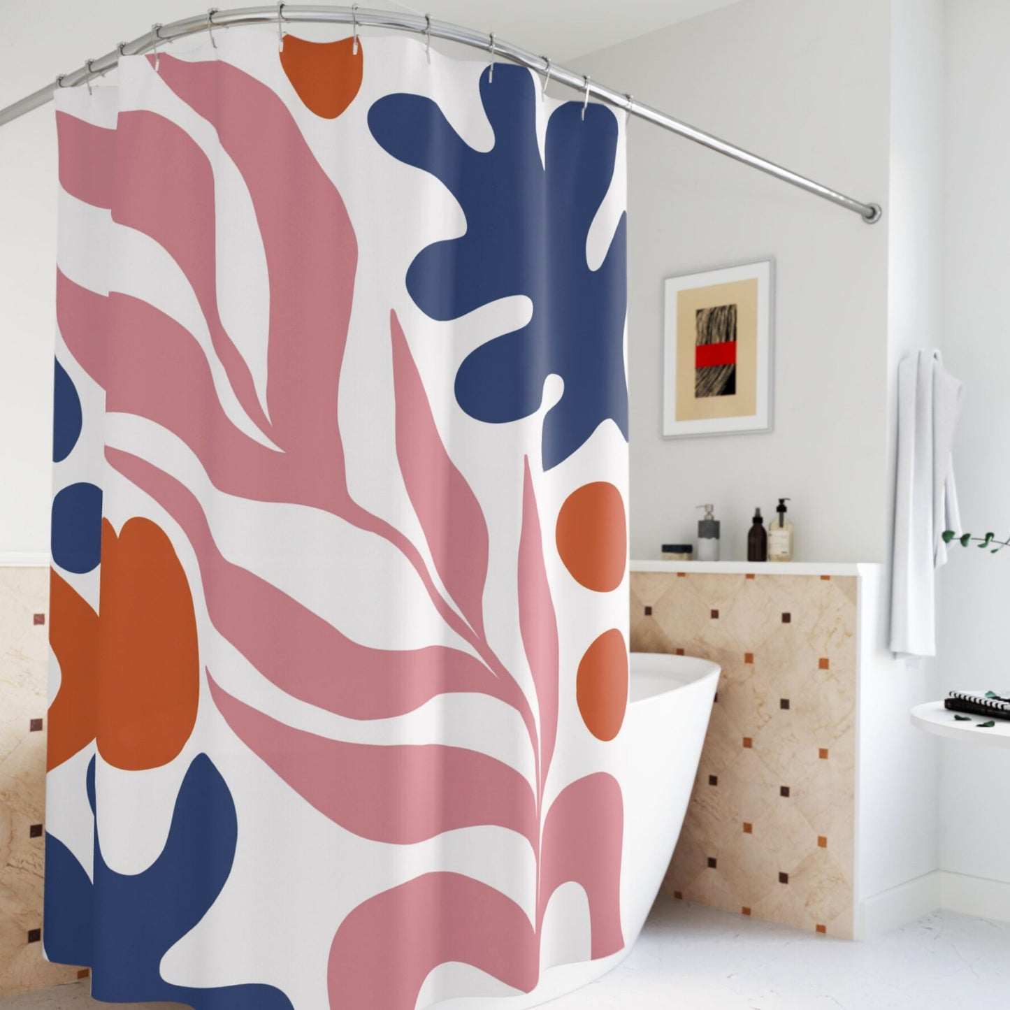 A bathroom with a shower curtain featuring a bold, abstract design in pink, orange, and blue with large leaf and shape motifs.