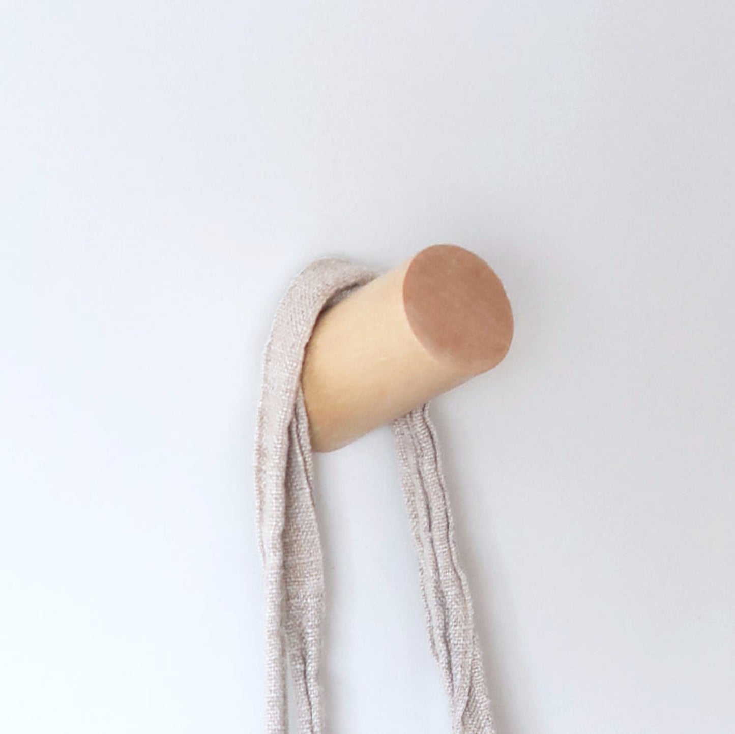  Solid birch wall hook holding a linen towel