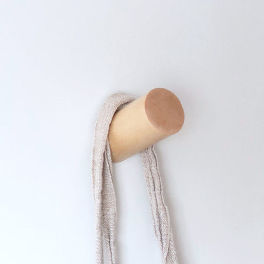  Solid birch wall hook holding a linen towel