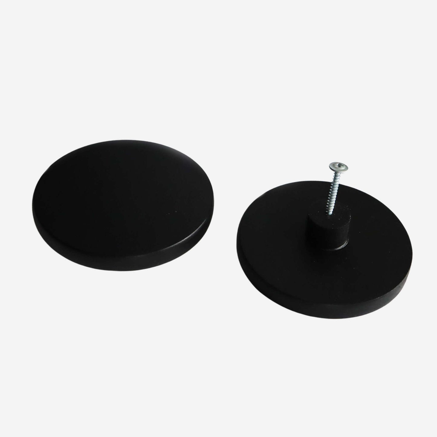 Black round wooden cabinet knobs with a smooth, modern finish, ideal for minimalist interiors.