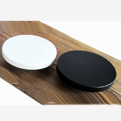 Black and white round wooden drawer pulls with a matte finish, painted with eco-friendly acrylic paint