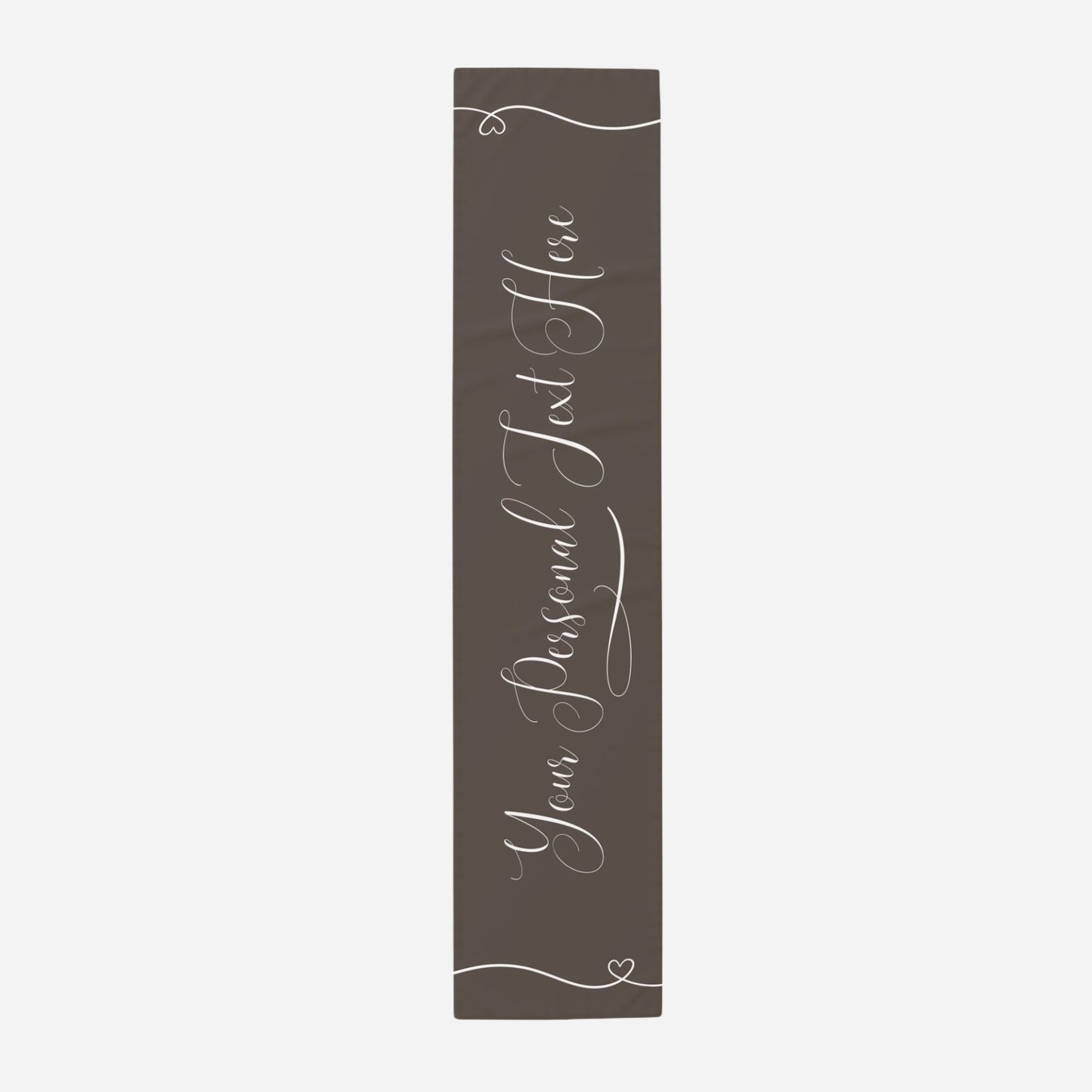 a dark brown table runner that reads "Your personal text here" in elegant script. 