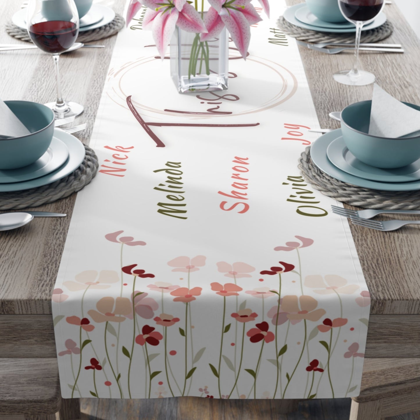 A personalized spring floral table runner featuring delicate flowers and custom family names.