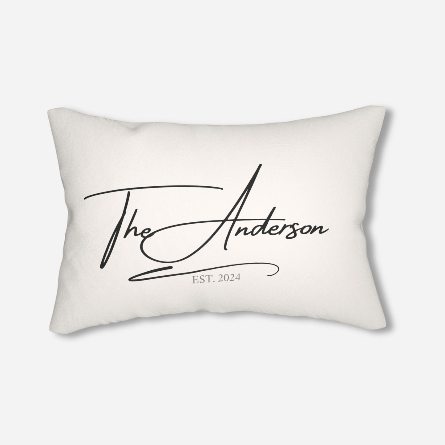 Custom pillow featuring the name "The Anderson" in stylish cursive and the establishment year "2024" on a white background.