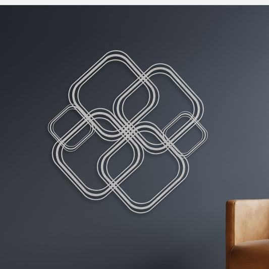 Modern metal wall art, abstract design against a dark background.