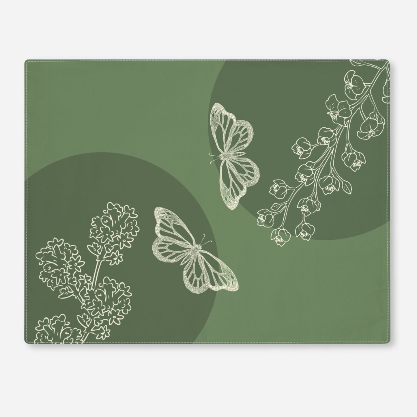 Elegant green placemat with intricate white line art of butterflies and flowers, blending botanical and geometric shapes.