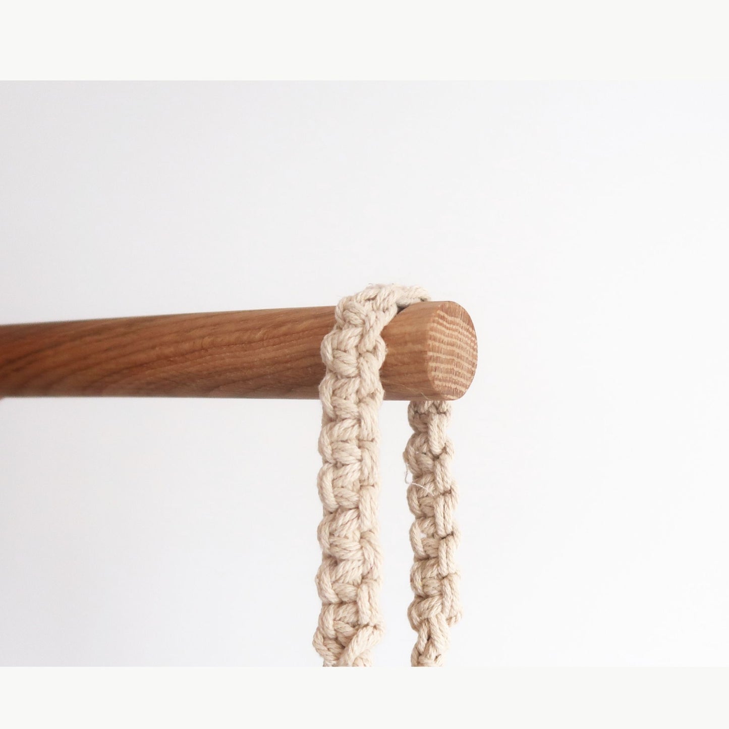 Minimalist oak wall hook with notch for hanging planters, made of solid oak