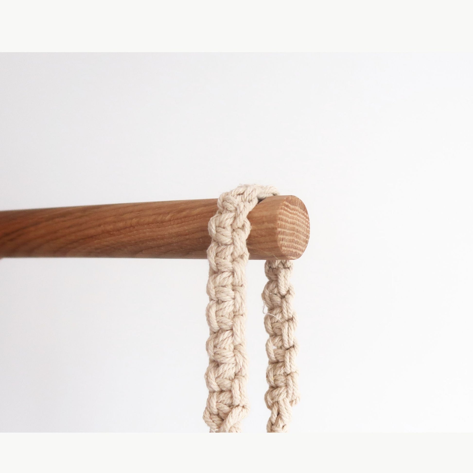 Minimalist oak wall hook with notch for hanging planters, made of solid oak