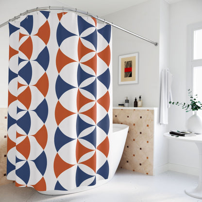 Bathroom with a shower curtain featuring a bold pattern of overlapping blue and orange semicircles on a white background.