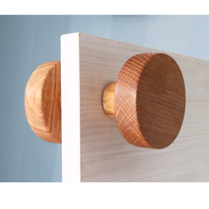 An elegant double-sided door knob made of oak wood