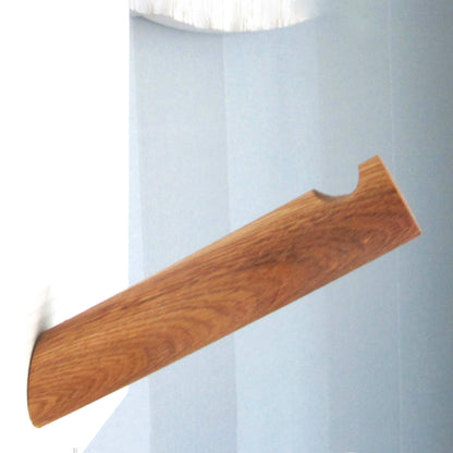 Handmade solid oak plant hook with an angled design and notched end for secure hanging