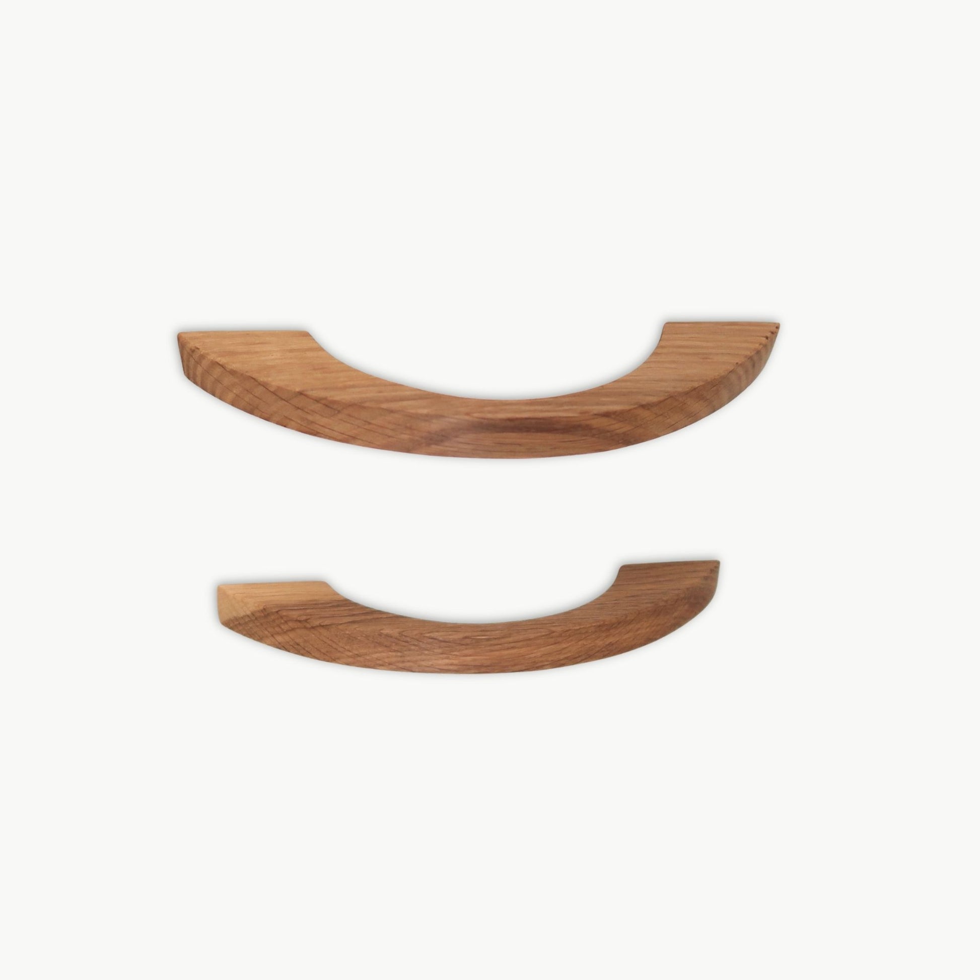Pair of oak cabinet handles with curved profile