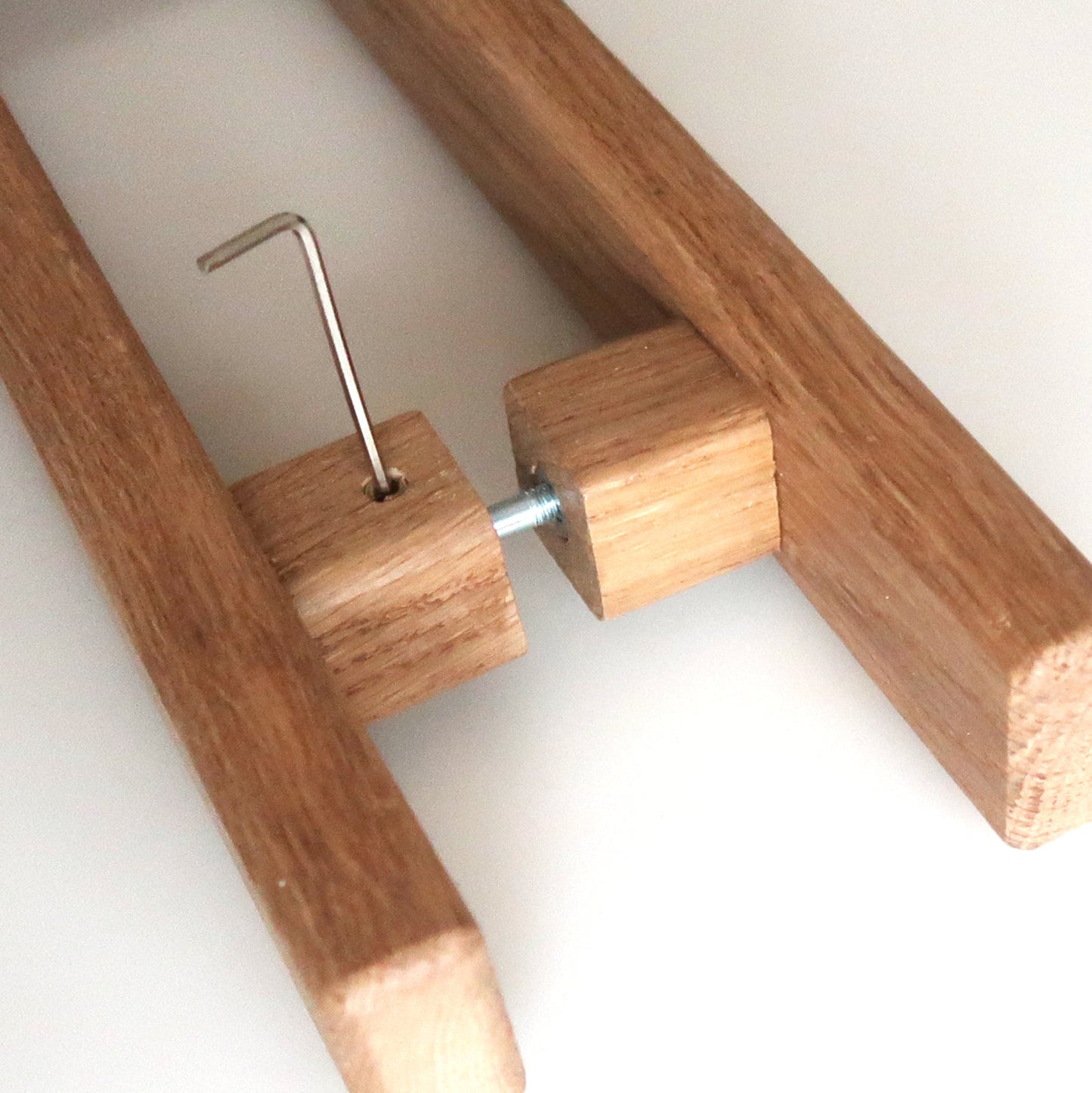 Wooden handles with metal bracket on a white background