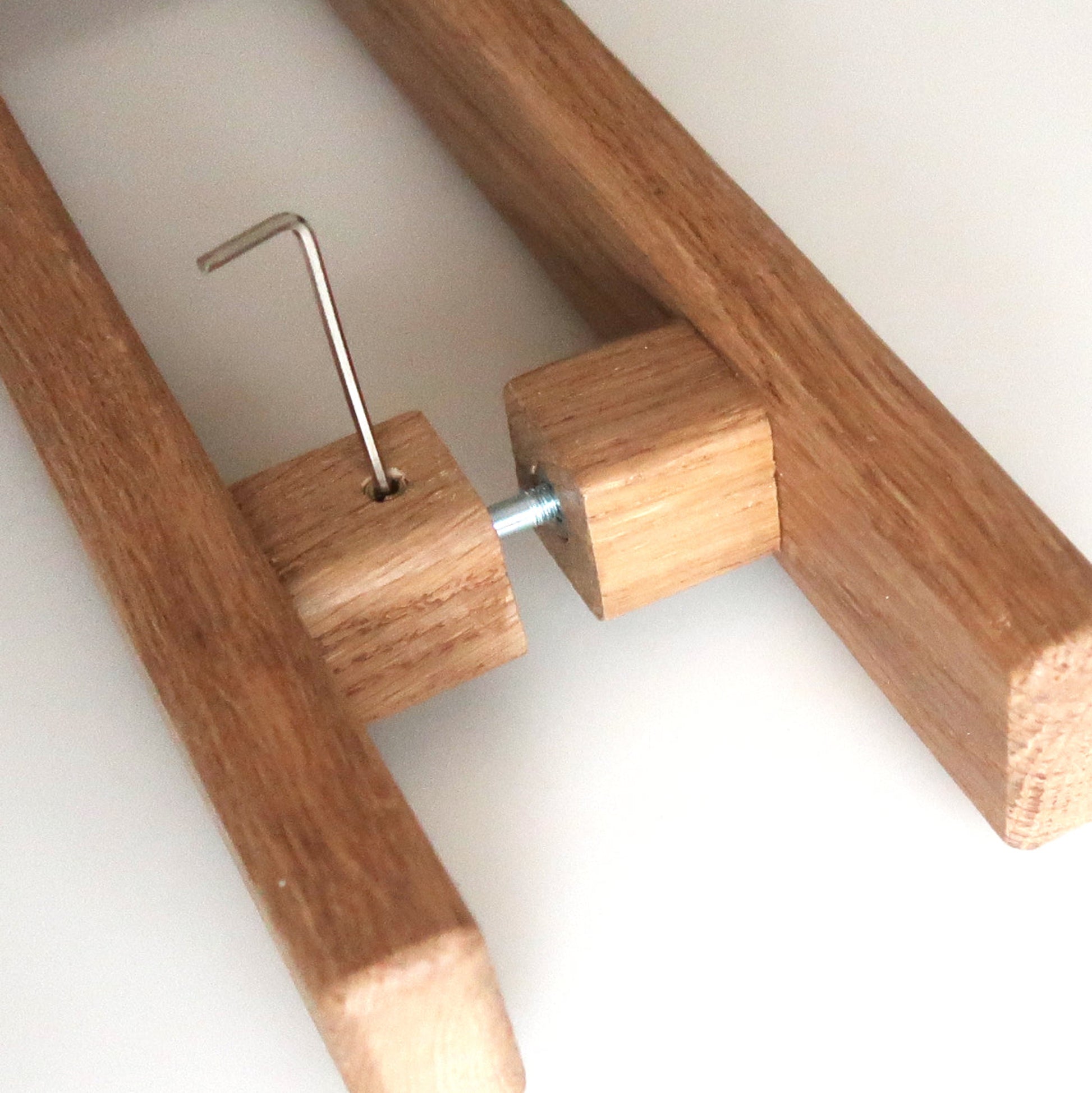 Wooden handles with metal bracket on a white background