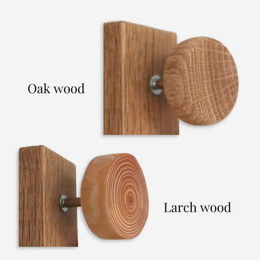 Handmade cabinet knobs in oak and larch wood with natural wood grain patterns