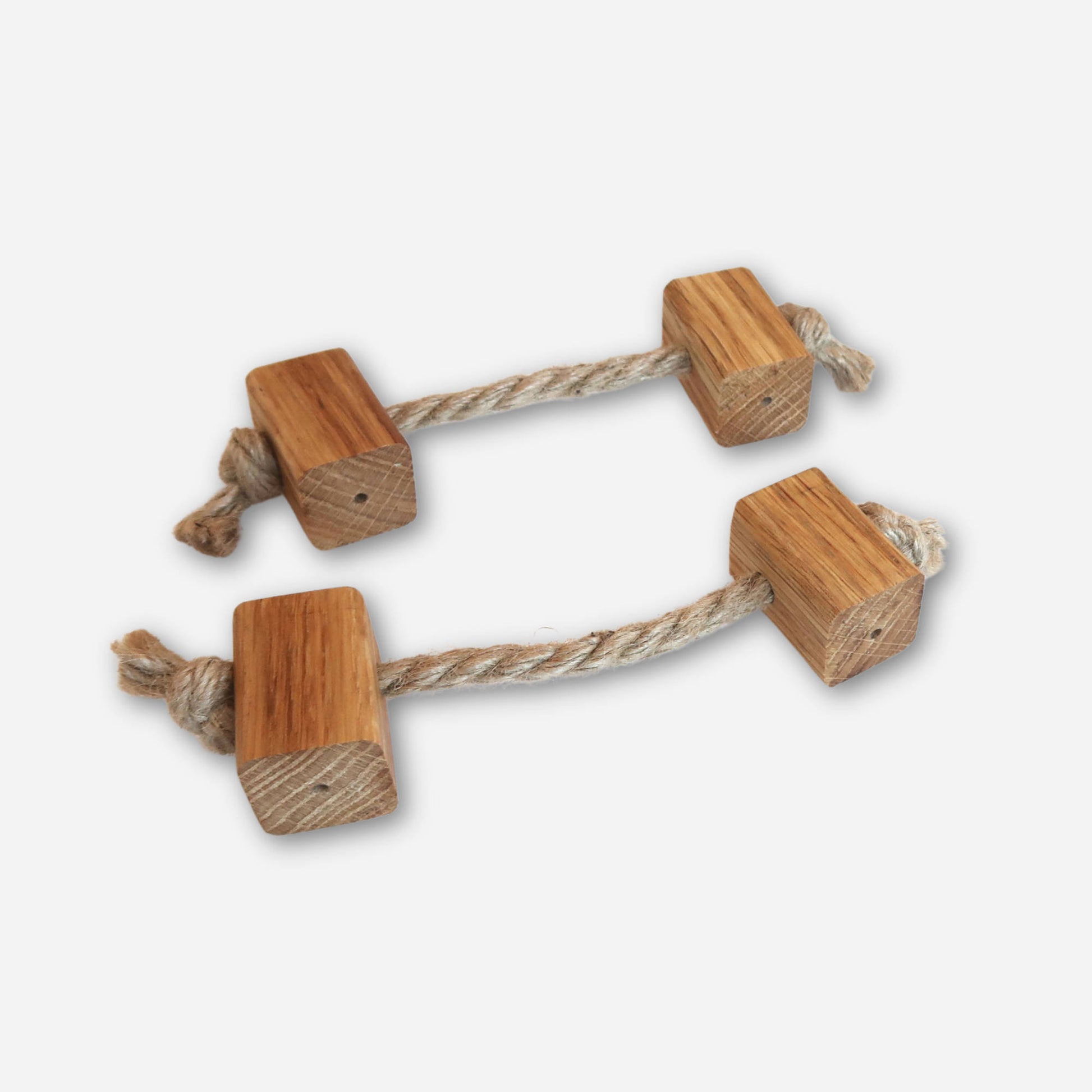 Beach-themed  drawer pulls made of rope and oak wood, with square wooden ends knotted on each side.