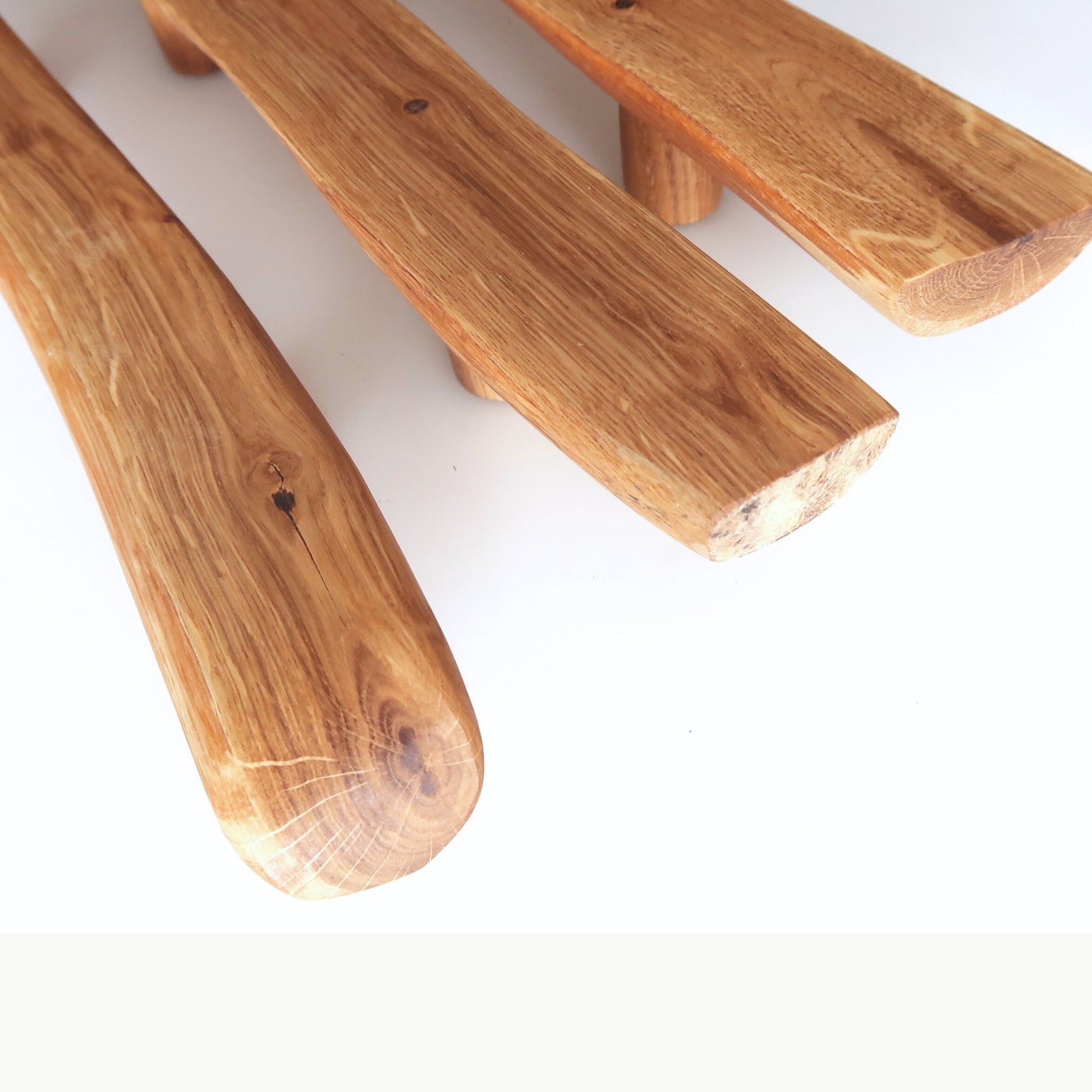 Three wooden handles on a white background