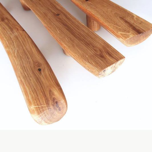 Three wooden handles on a white background