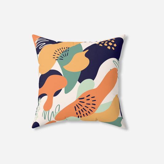  A throw pillow with a retro abstract design featuring bold, overlapping shapes in shades of orange, navy blue, green, and cream, creating a vibrant and eclectic look.