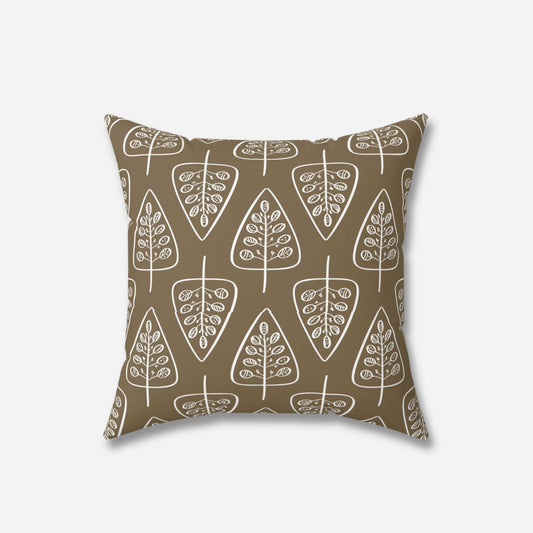 A brown throw pillow with a pattern of white stylized trees arranged in rows, creating a rustic and natural look.