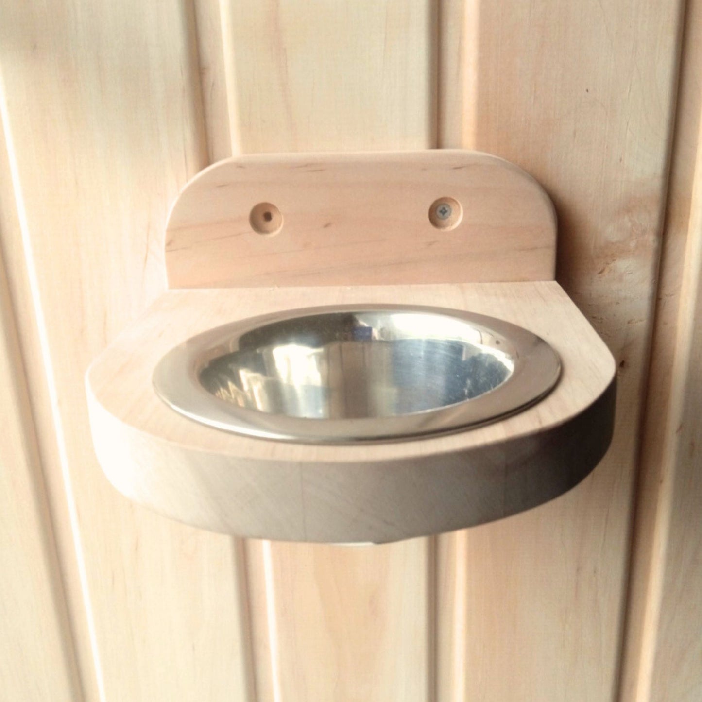 sauna interior with wooden aroma holder on wall