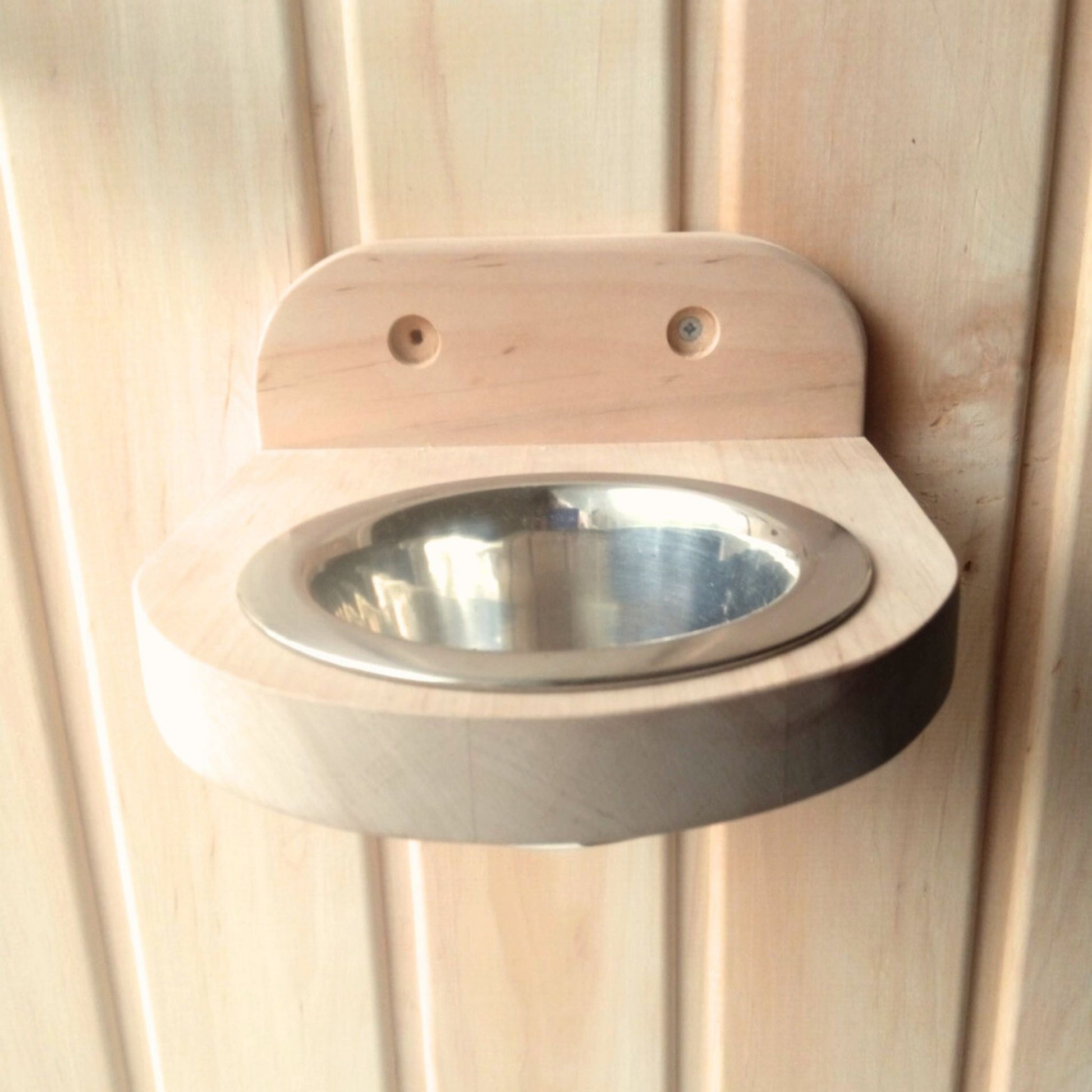 sauna interior with wooden aroma holder on wall