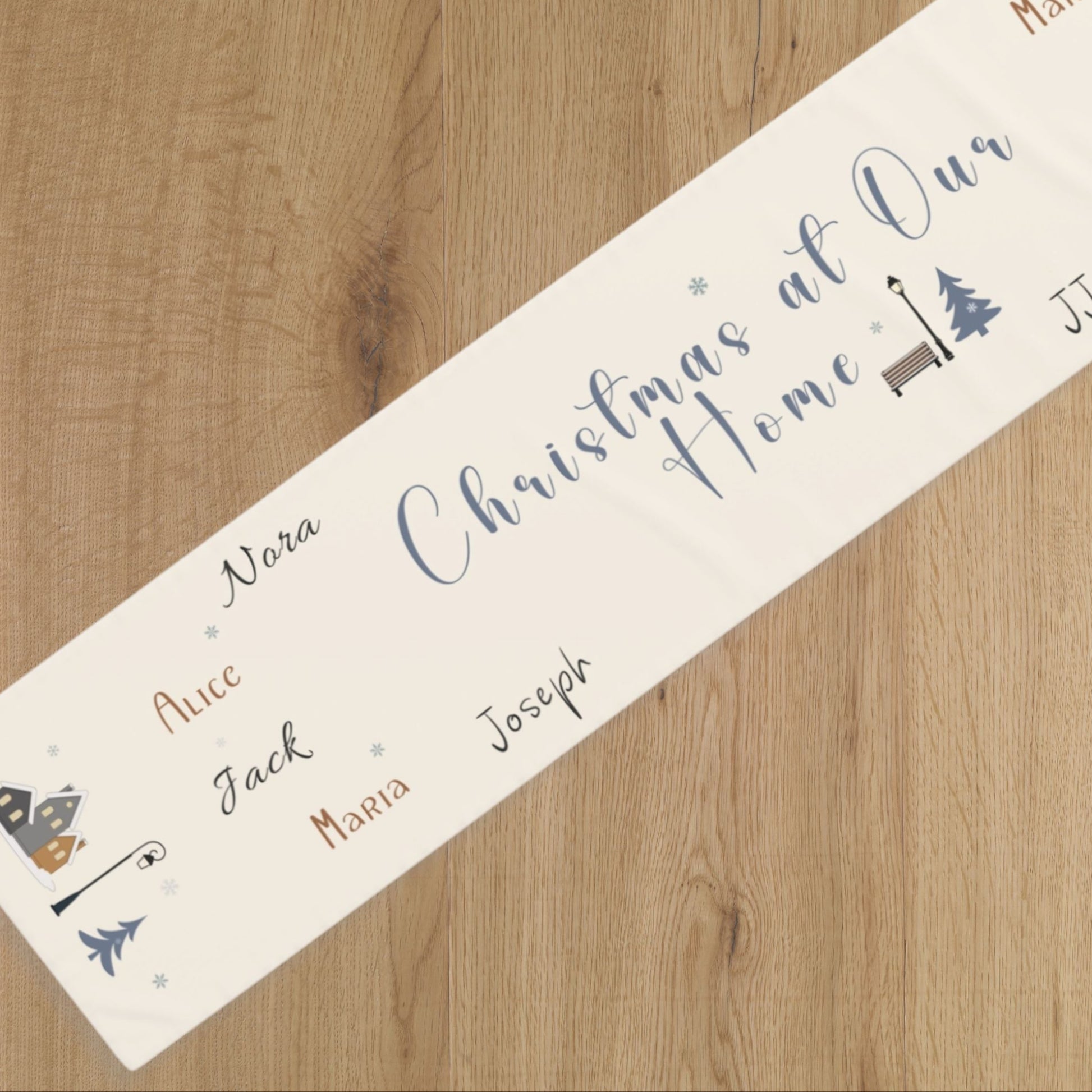 Personalized Christmas runner with names on a wooden surface