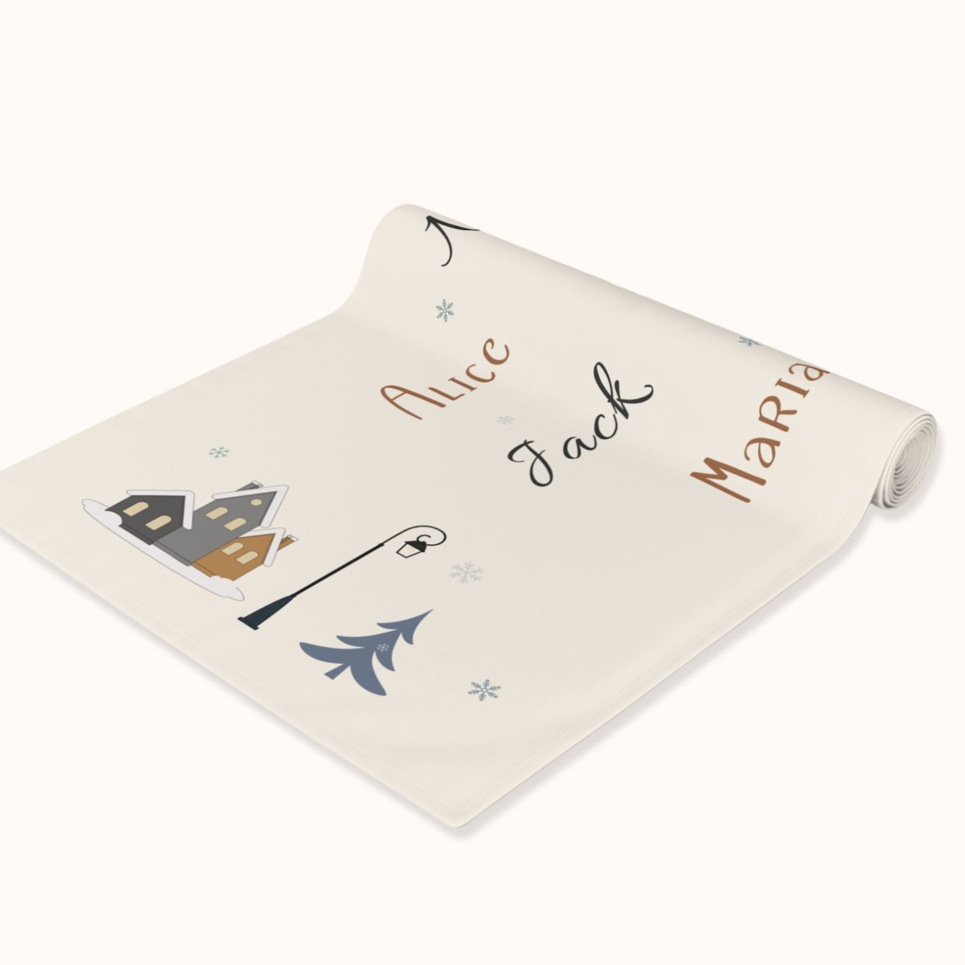 Roll of table runner with names and winter village