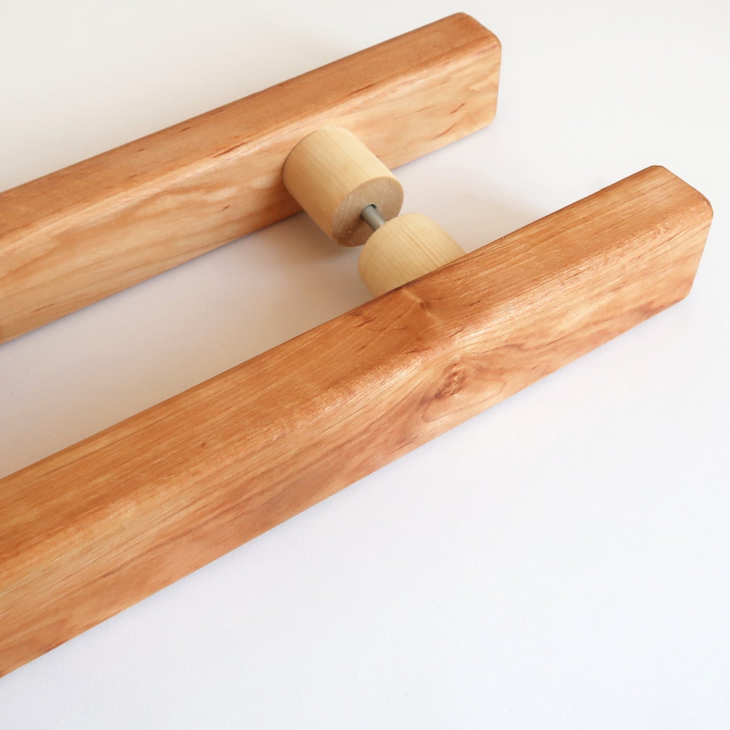 Side view of a long double-sided alder sauna door handle
