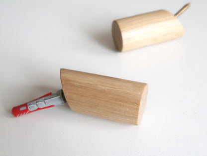 Minimal solid oak wall hook with concealed wall mounting