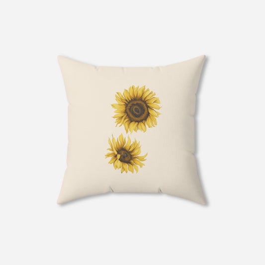  A decorative pillow with a light beige background and two detailed sunflower illustrations, one above the other, adding a touch of nature-inspired elegance.