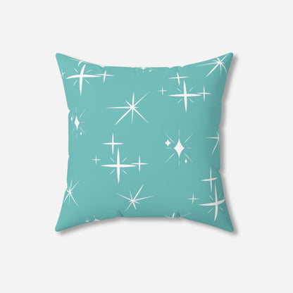  Decorative cushion showcasing a vintage-inspired pattern with white radial starburst designs on teal