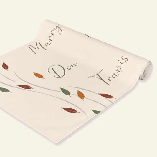 Personalized runner with names and leaf patterns on a white background