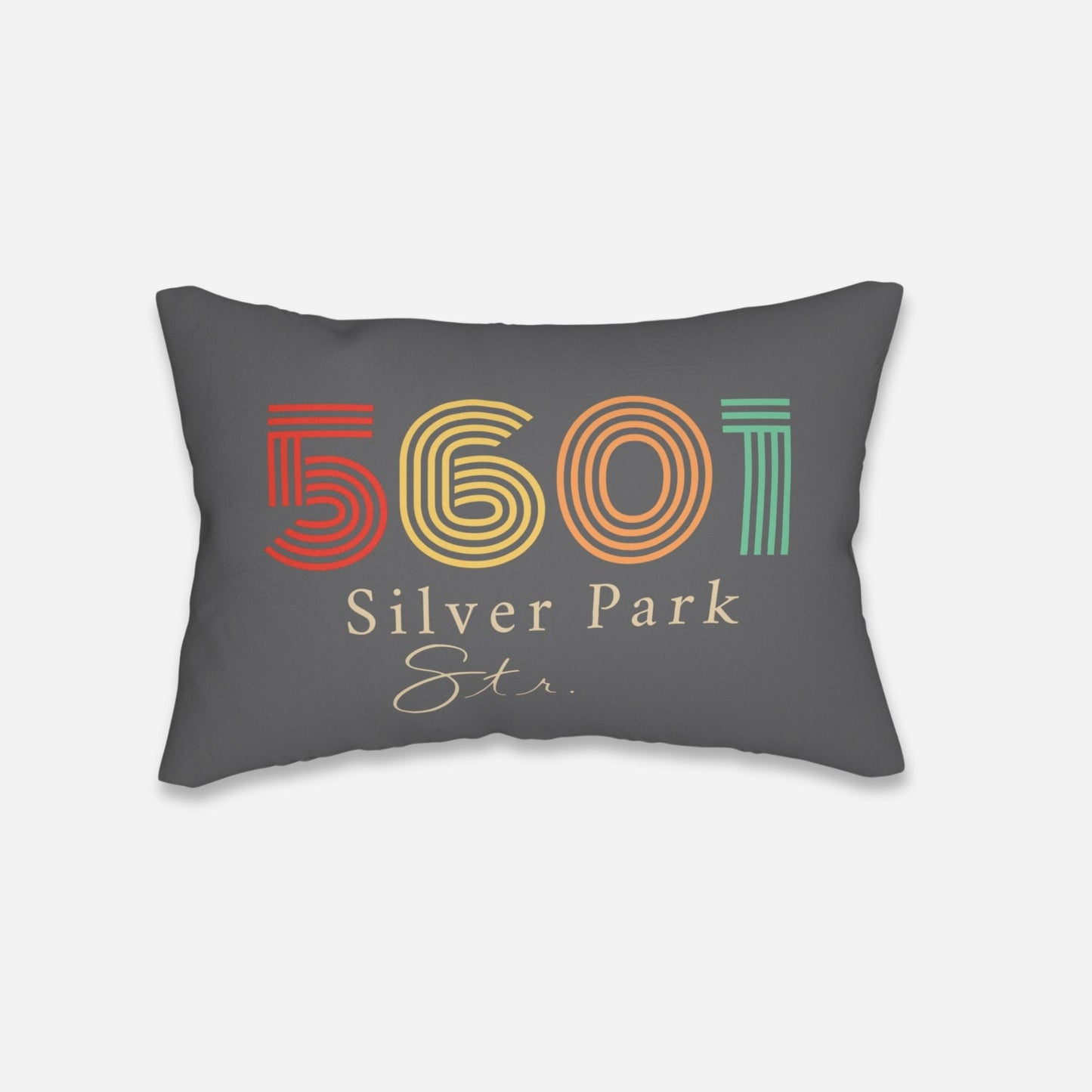 decorative pillow showcasing a retro-style text charcoal grey with multicolored numbers.