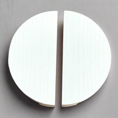 Handcrafted semicircle wooden drawer handles in a sleek white finish.