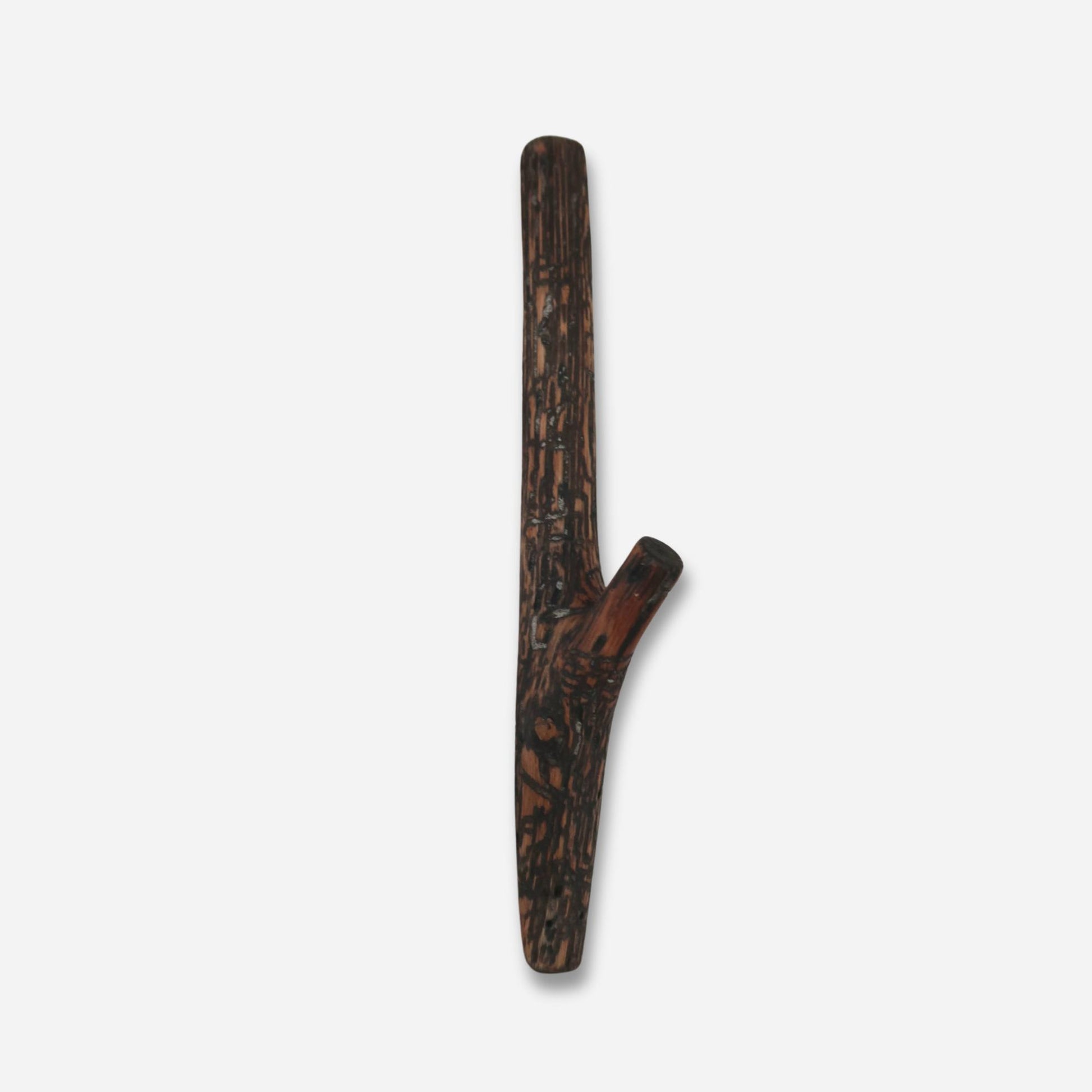 An individual handcrafted wooden wall hook made from oak, featuring a unique mix of light and dark wood grains, set against a plain white backdrop.